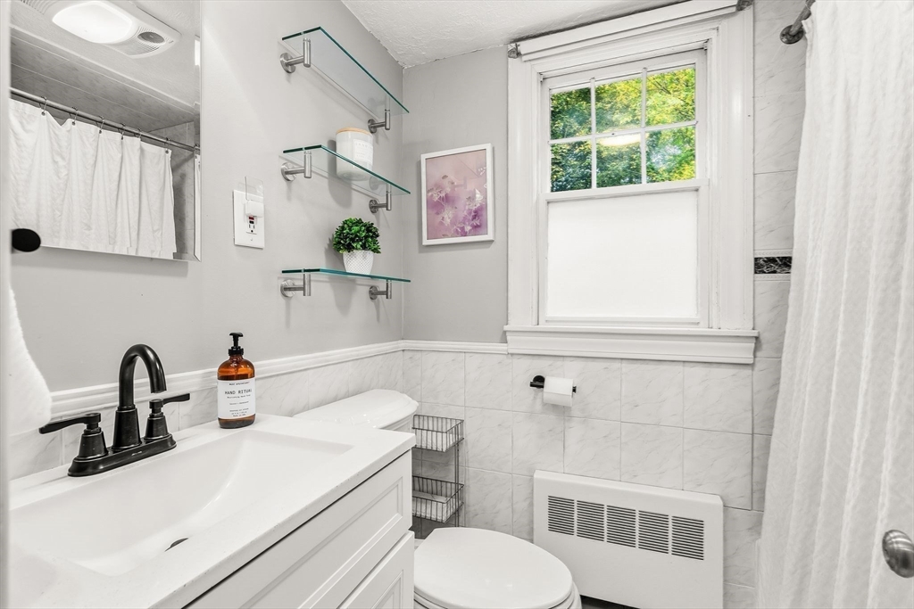 15 Bayberry Road Hingham, MA 02043 - Photo 19 of 24 a bathroom with a sink a toilet and a window