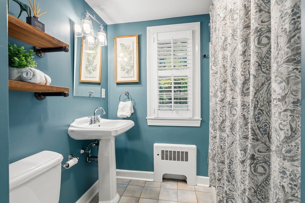 15 Bayberry Road Hingham, MA 02043 - Photo 20 of 24 a bathroom with a sink a toilet and a window