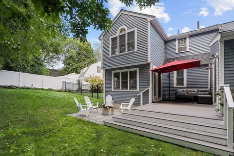 a view of house with a back yard