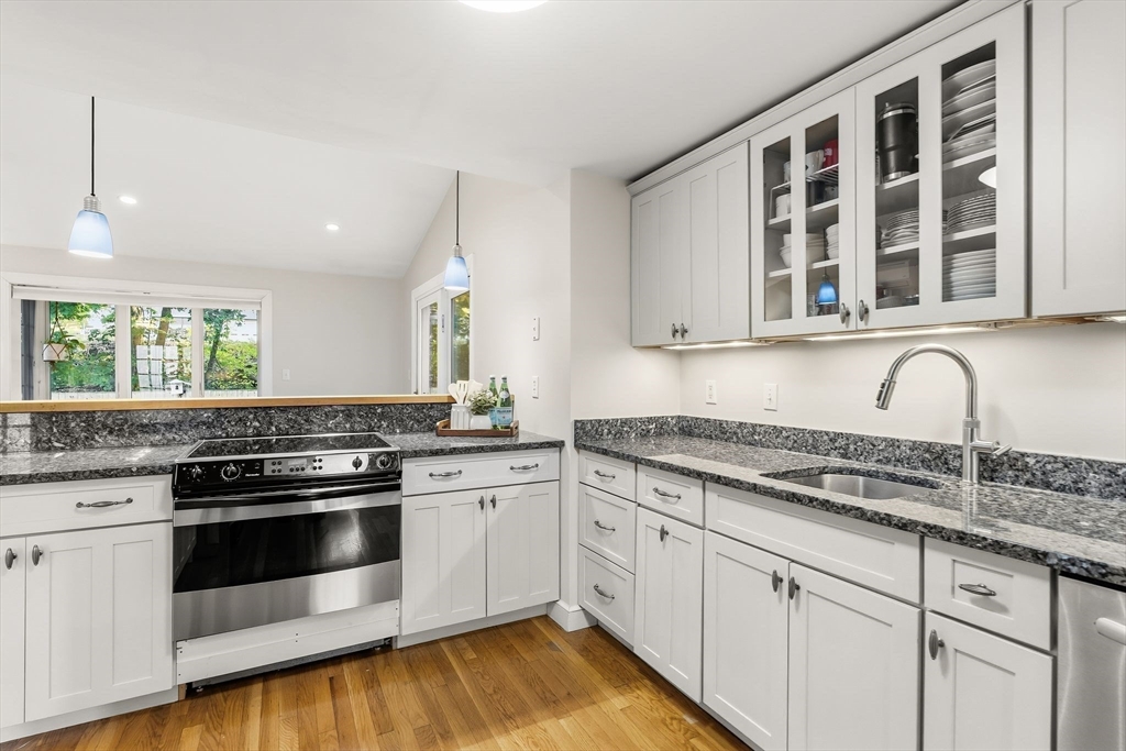 15 Bayberry Road Hingham, MA 02043 - Photo 4 of 24 a kitchen with stainless steel appliances granite countertop white cabinets and window