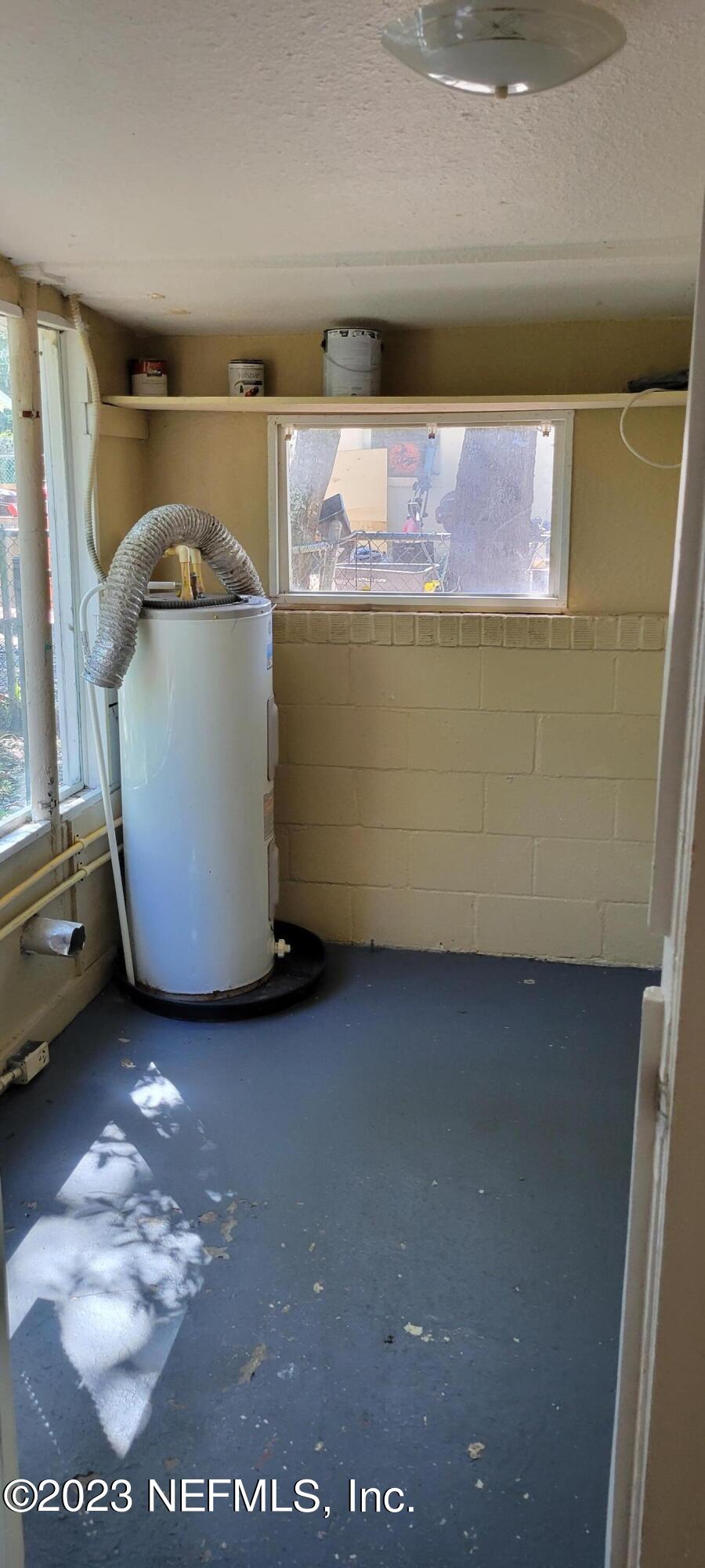 4069 Walnut Street Jacksonville, FL 32206 - Photo 14 of 14 a room with a washing machine