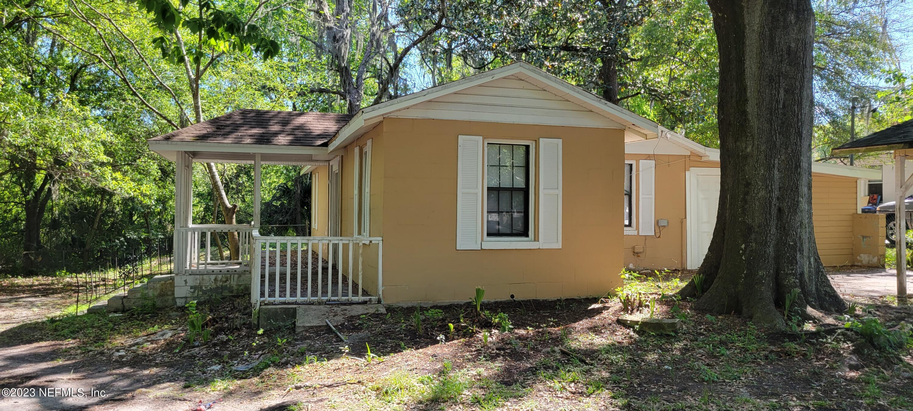 4069 Walnut Street Jacksonville, FL 32206 - Photo 3 of 14 a front view of a house with a yard