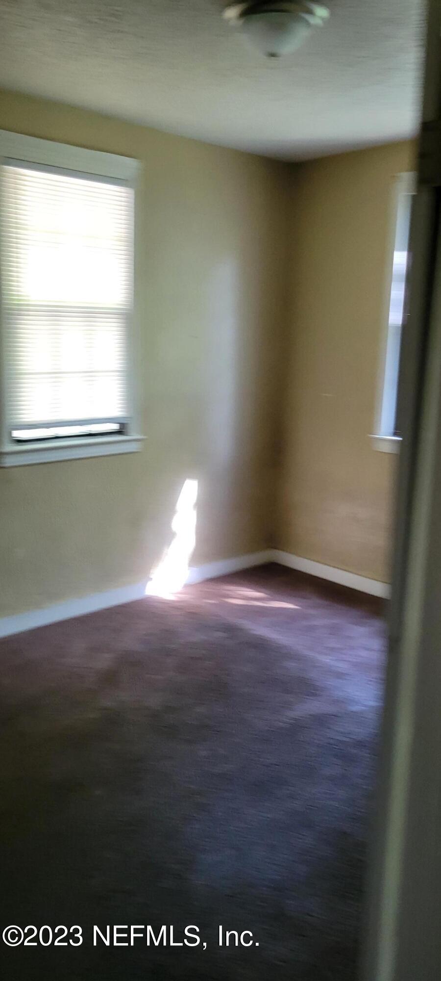 4069 Walnut Street Jacksonville, FL 32206 - Photo 5 of 14 a view of empty room with window