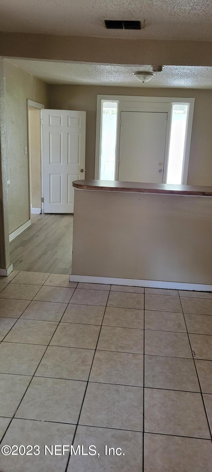 4069 Walnut Street Jacksonville, FL 32206 - Photo 8 of 14 a view of a livingroom with an empty space and window