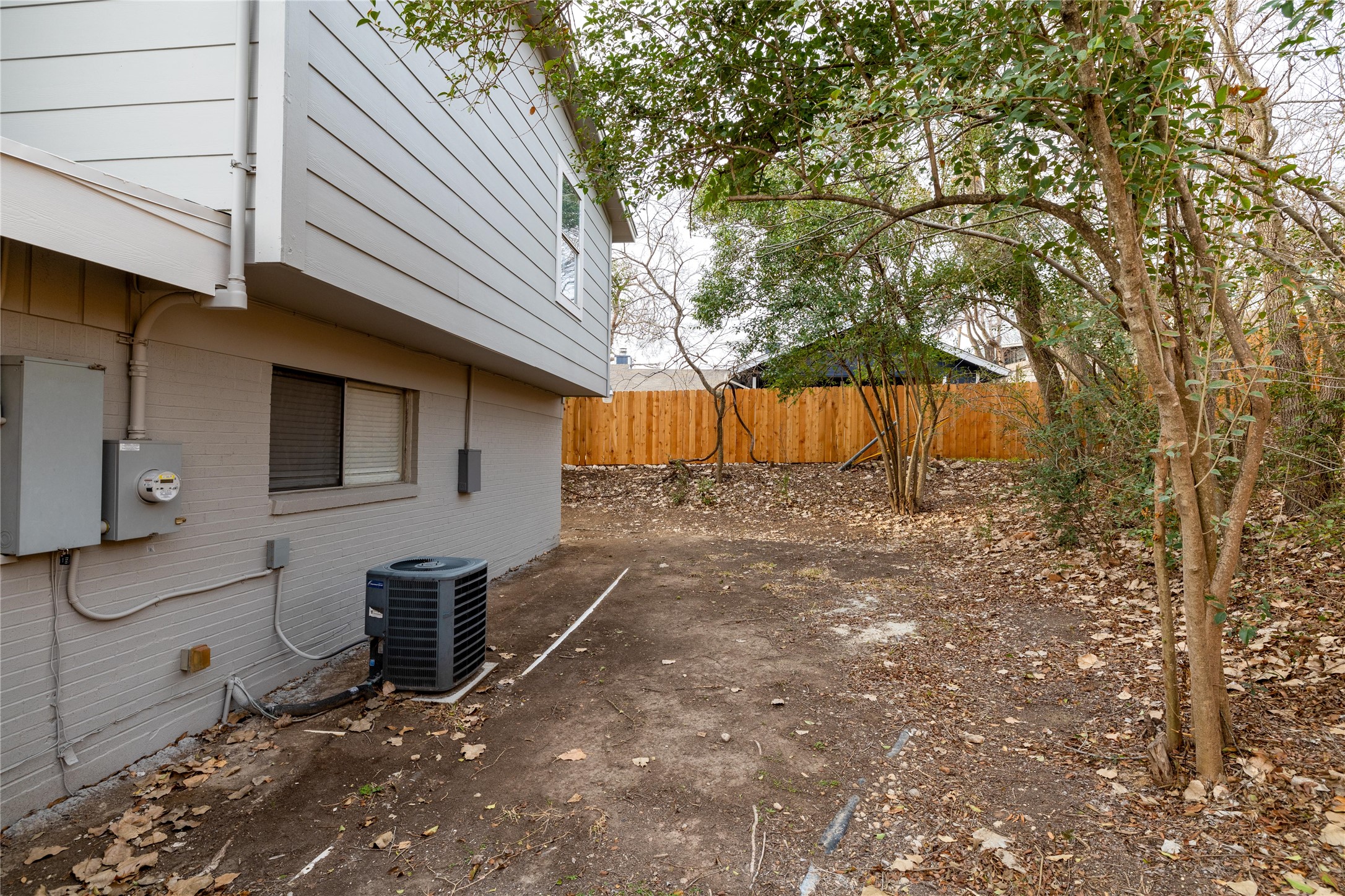 4304 Scottsdale Road Austin, TX 78721 - Photo 20 of 21 View of property exterior featuring brick siding and a central AC unit