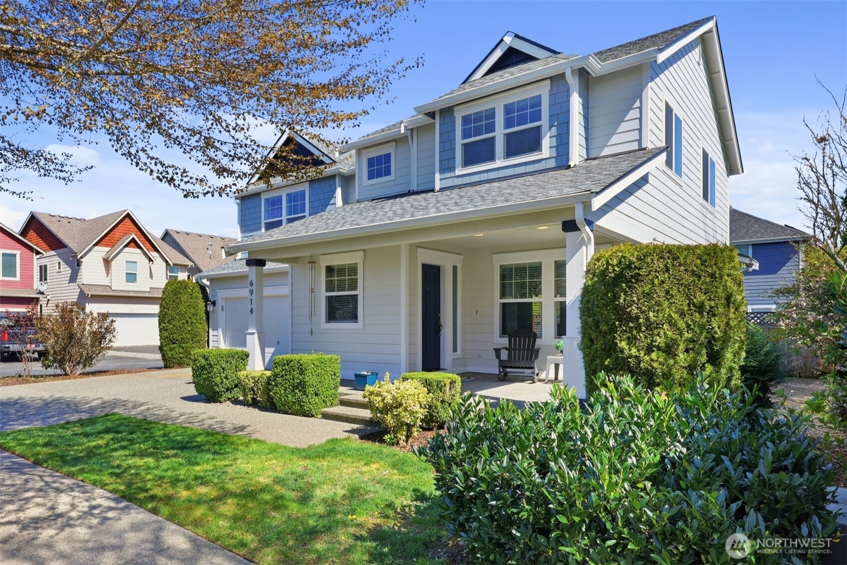 a front view of a house with garden