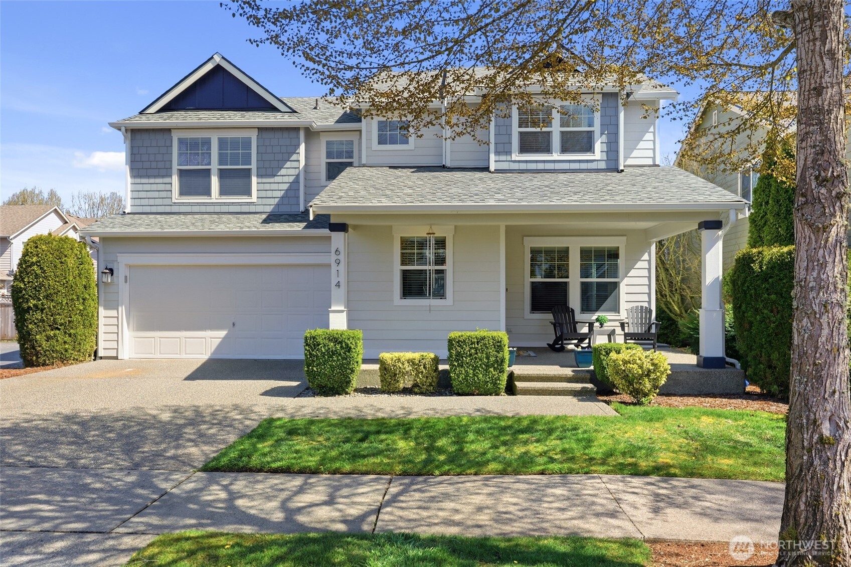 6914 Axis Street Southeast Lacey, WA 98513 - Photo 2 of 38 a front view of a house with garden
