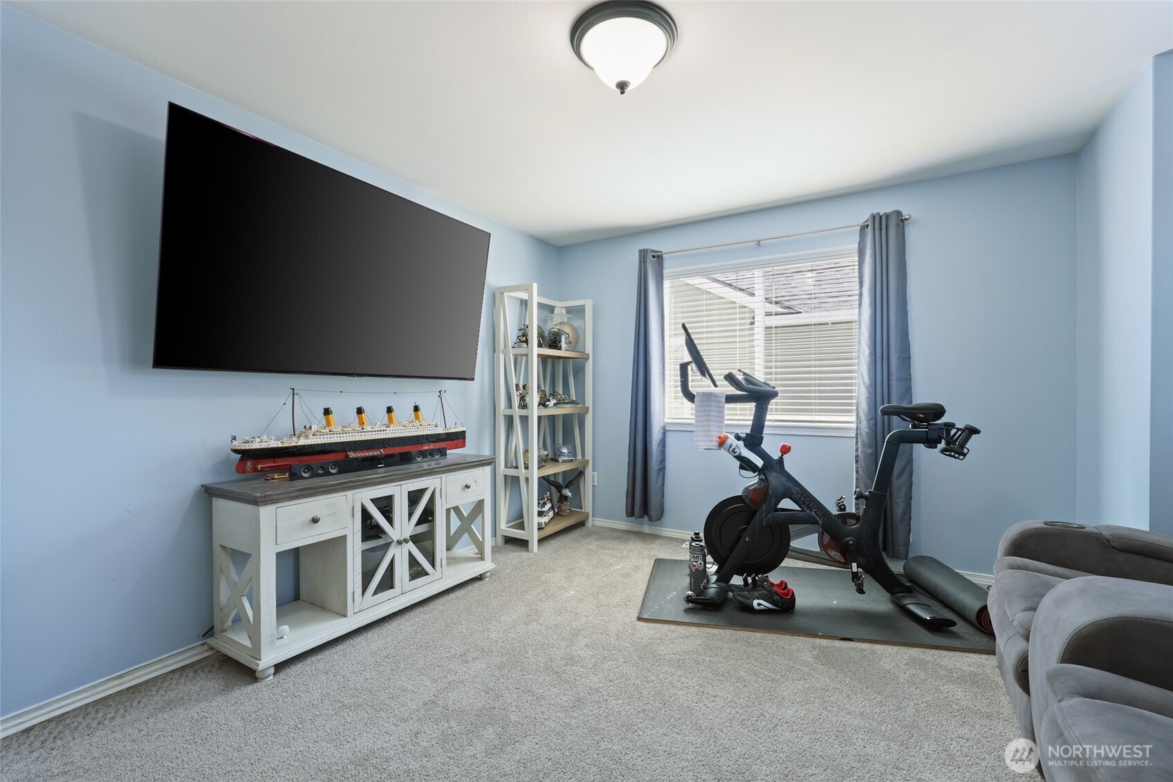 6914 Axis Street Southeast Lacey, WA 98513 - Photo 26 of 38 a view of room with gym equipment and a flat screen tv