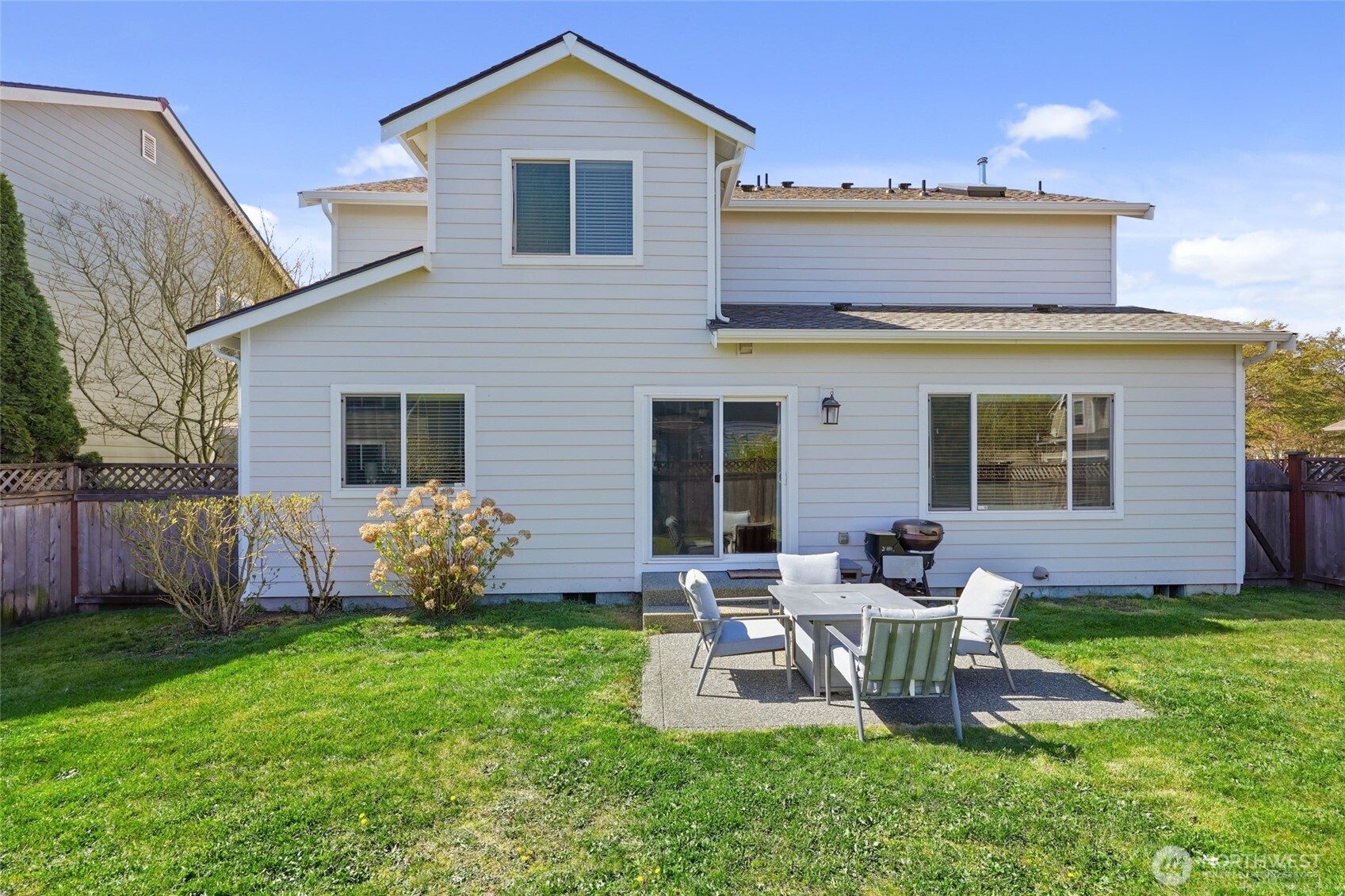 6914 Axis Street Southeast Lacey, WA 98513 - Photo 33 of 38 a front view of a house with garden and chairs
