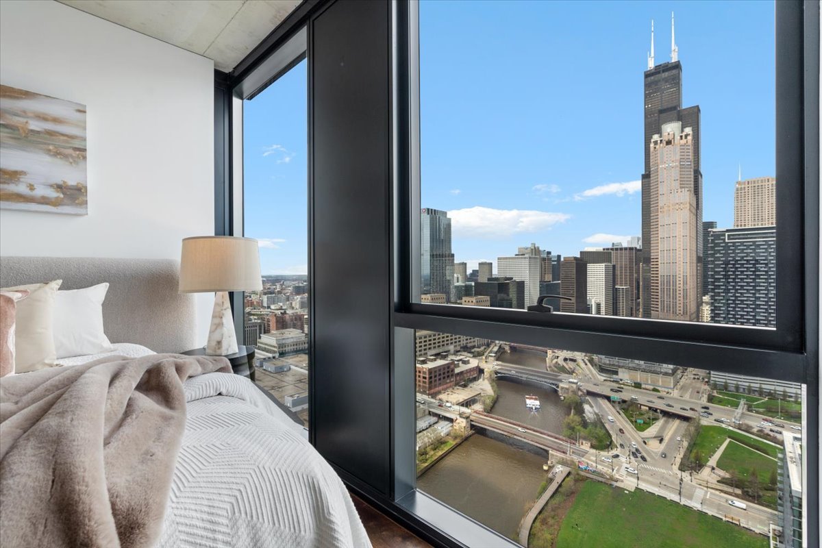 234 West Polk Street, Unit 3708 Chicago, IL 60607 - Photo 14 of 44 a bedroom with a bed and window