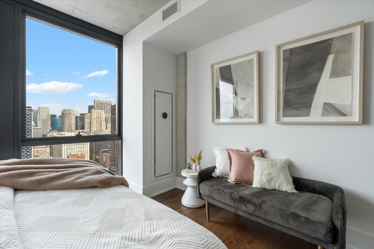 234 West Polk Street, Unit 3708 Chicago, IL 60607 - Photo 15 of 44 a bedroom with furniture and a large window