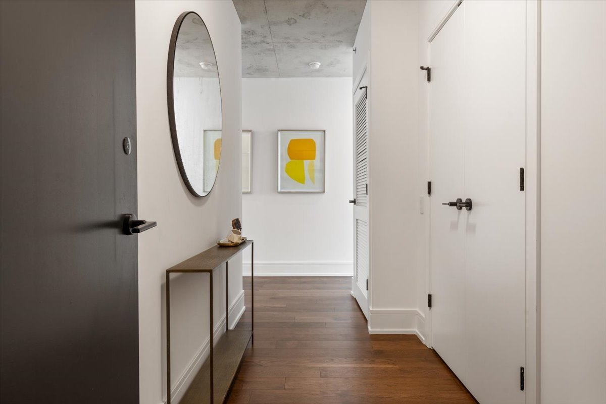 234 West Polk Street, Unit 3708 Chicago, IL 60607 - Photo 3 of 44 a view of a bathroom from a corridor