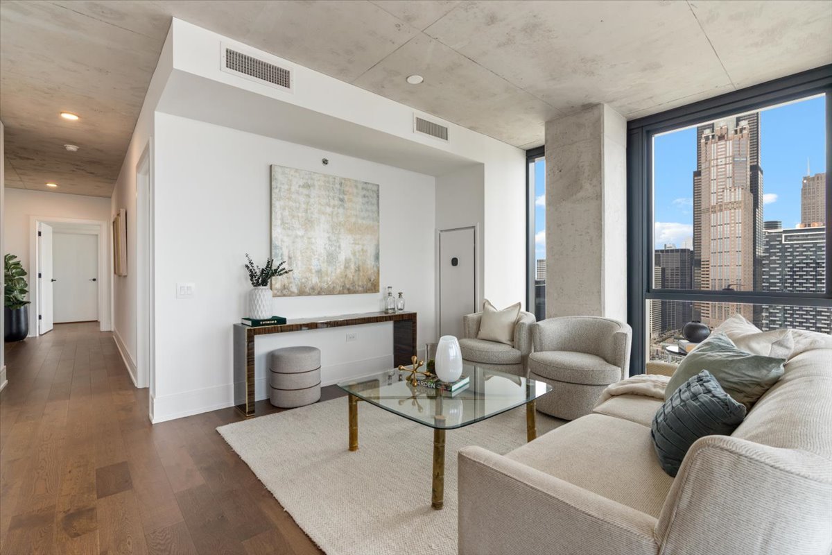 234 West Polk Street, Unit 3708 Chicago, IL 60607 - Photo 7 of 44 a living room with furniture and a large window
