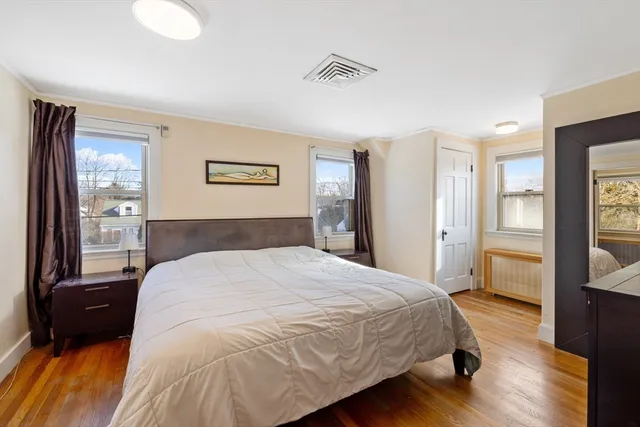 a spacious bedroom with a bed and a walk in closet