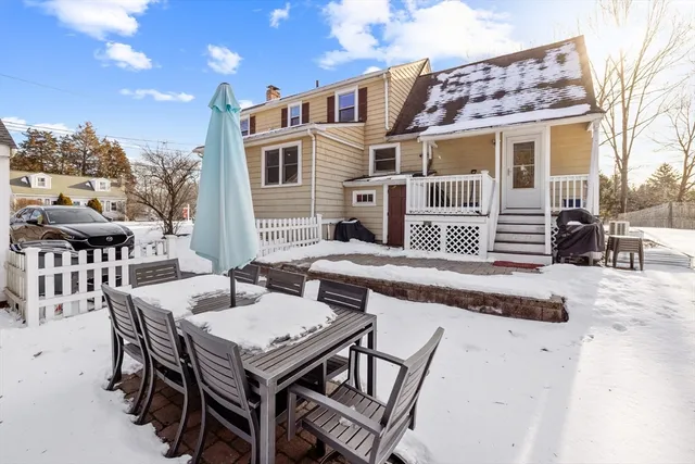 a view of a patio with a table and chairs