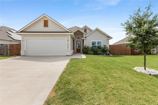 a front view of a house with yard
