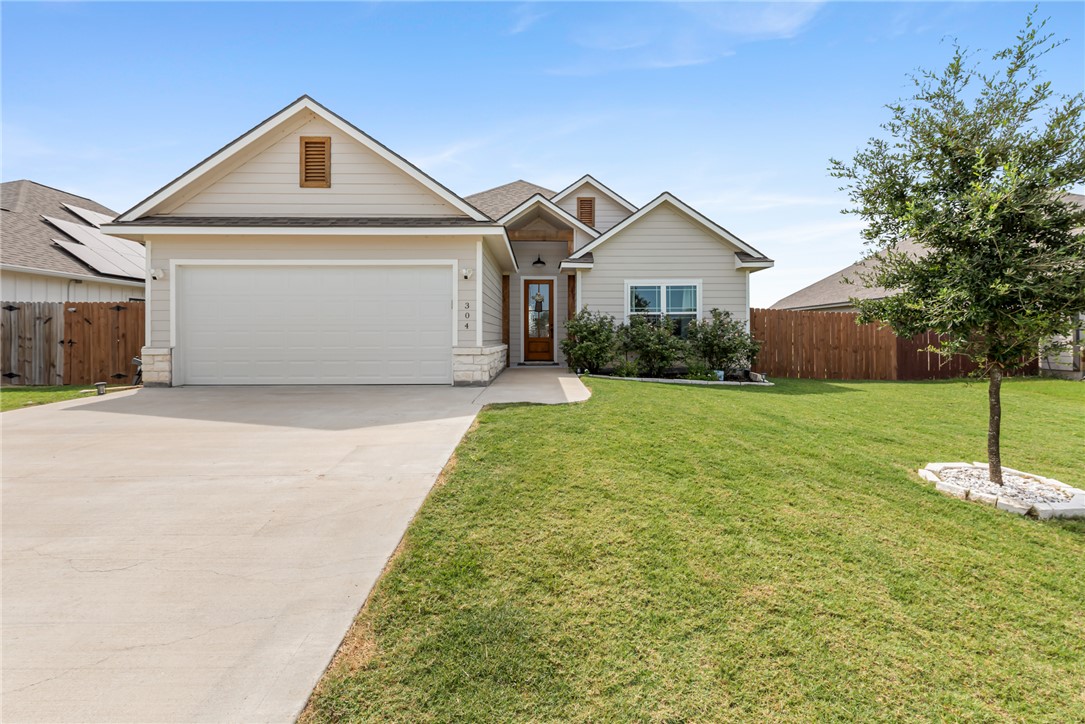 a front view of a house with yard