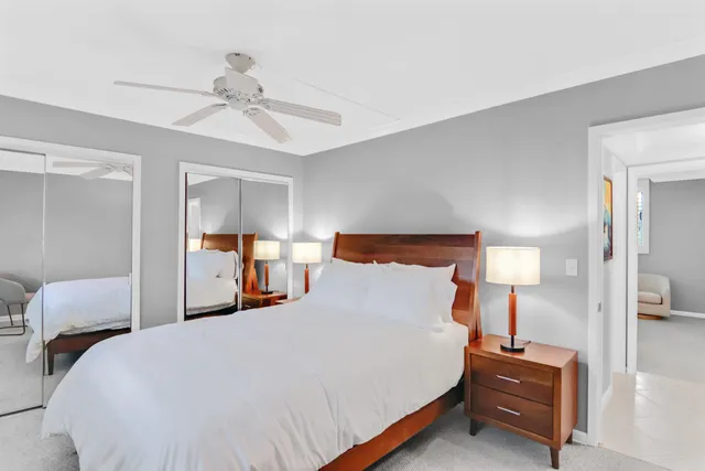 a bedroom with a bed and a lamp