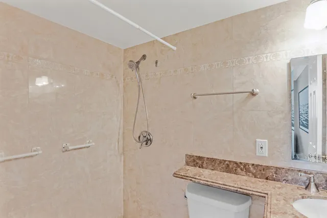 a bathroom with a sink and shower