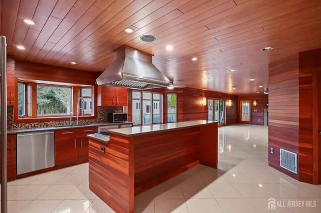 a view of a livingroom with wooden floor and a window
