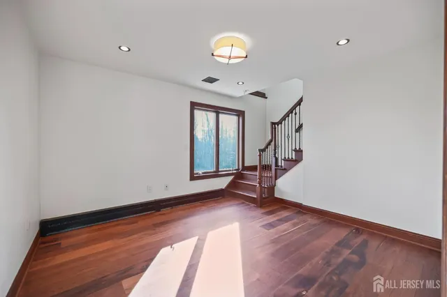 a garden with trees in front of it