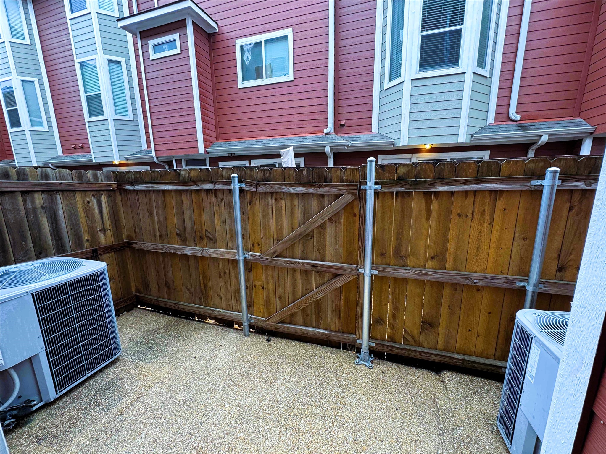 1198 Jones-Butler Road, Unit 2707 College Station, TX 77840 - Photo 15 of 24 a view of a backyard with a chair and wooden floor