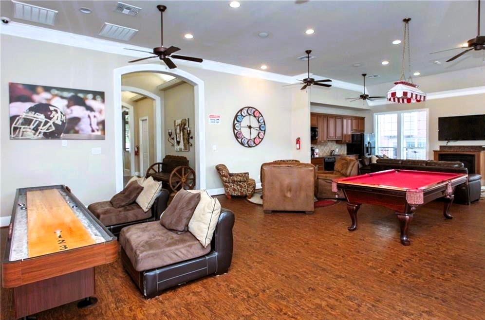 1198 Jones-Butler Road, Unit 2707 College Station, TX 77840 - Photo 20 of 24 a living room with furniture a flat screen tv and kitchen view