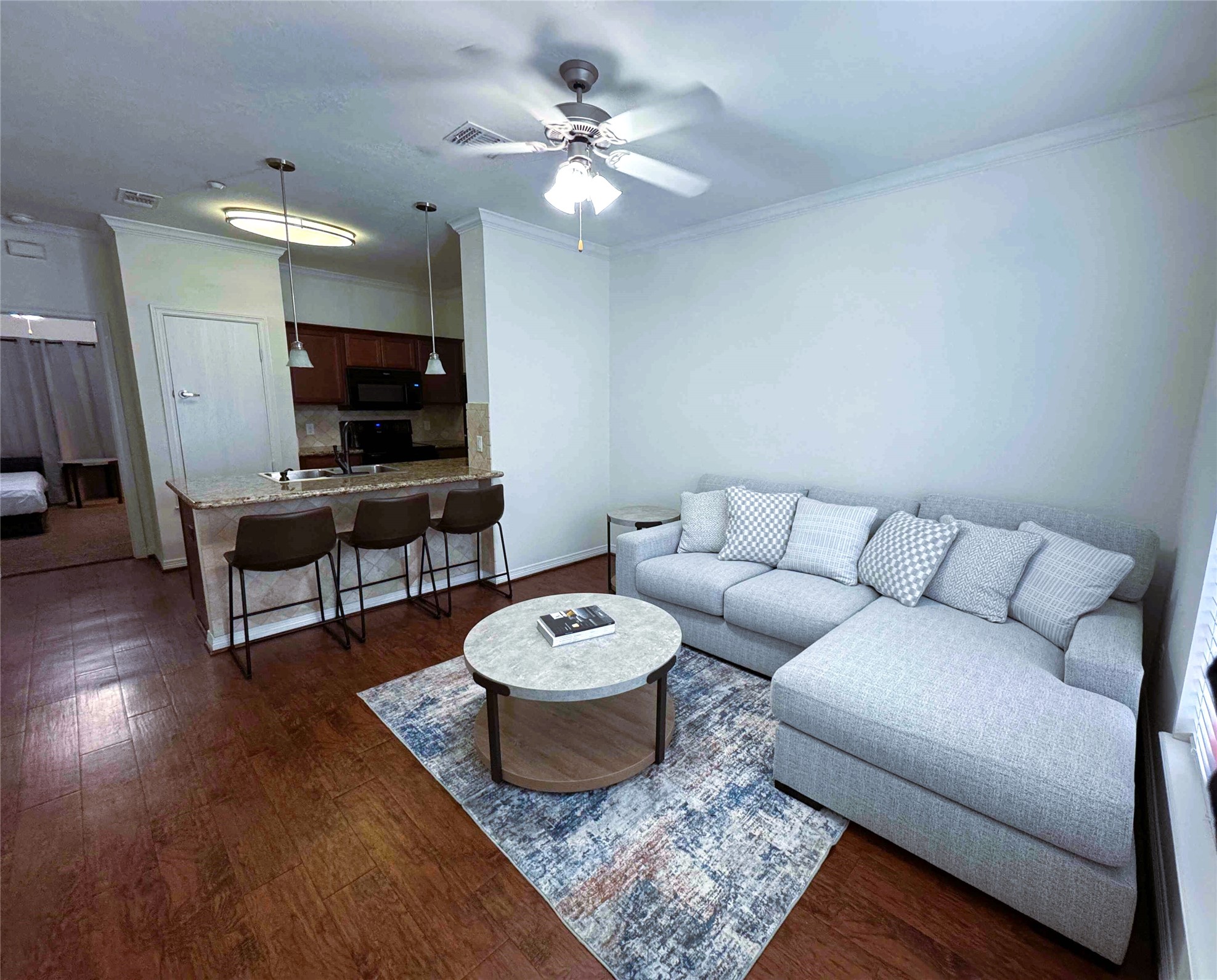 1198 Jones-Butler Road, Unit 2707 College Station, TX 77840 - Photo 6 of 24 a living room with furniture a fireplace and a flat screen tv