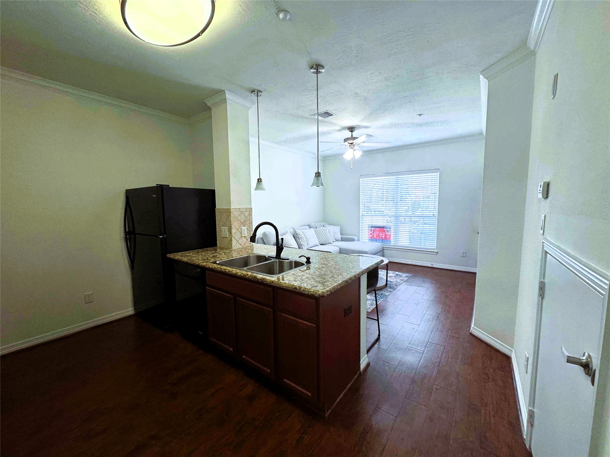 1198 Jones-Butler Road, Unit 2707 College Station, TX 77840 - Photo 8 of 24 a kitchen with a stove a sink and a refrigerator