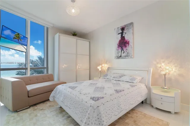 a bed room with a bed and a couch