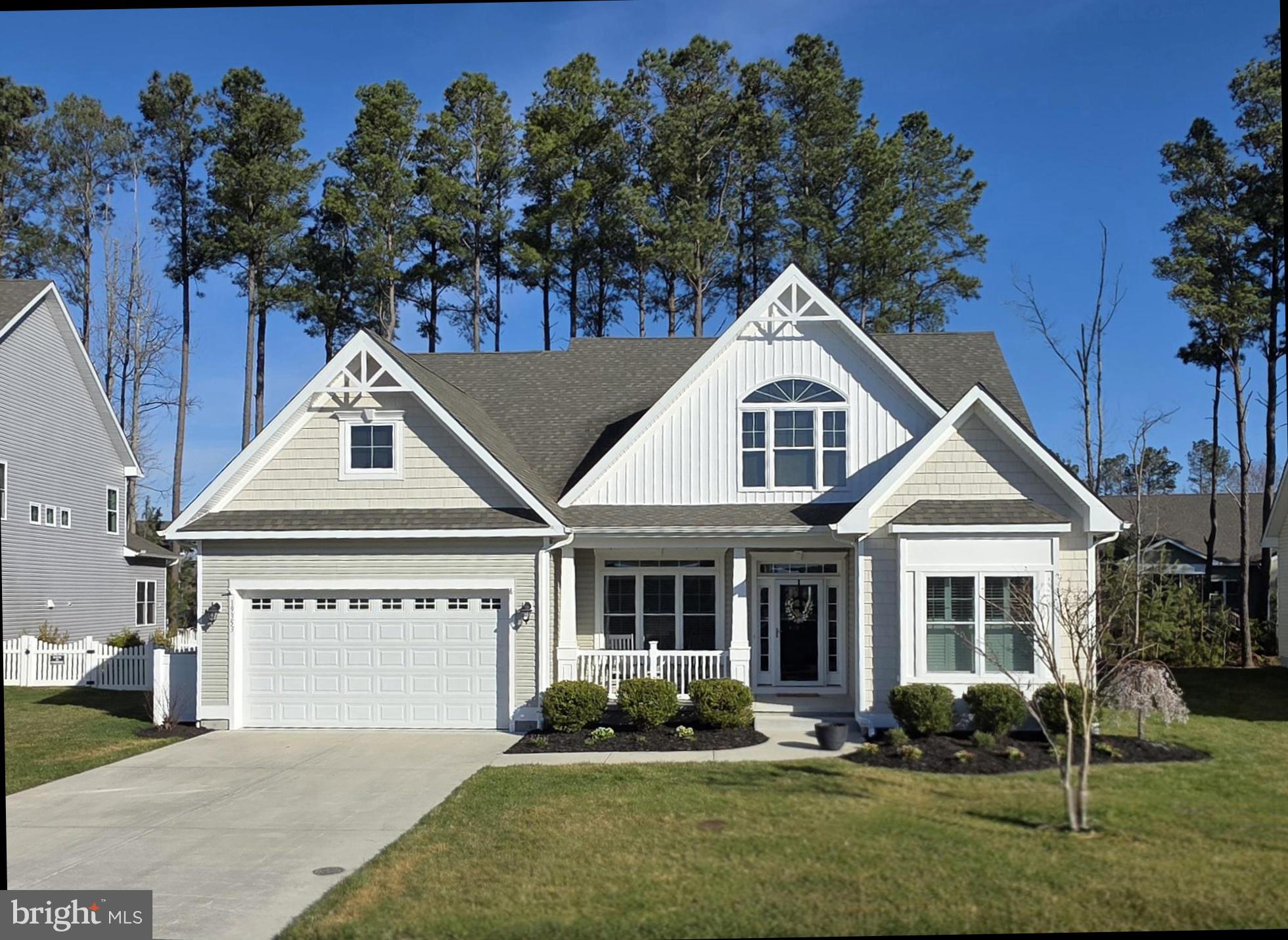 Charming home nestled among trees.
