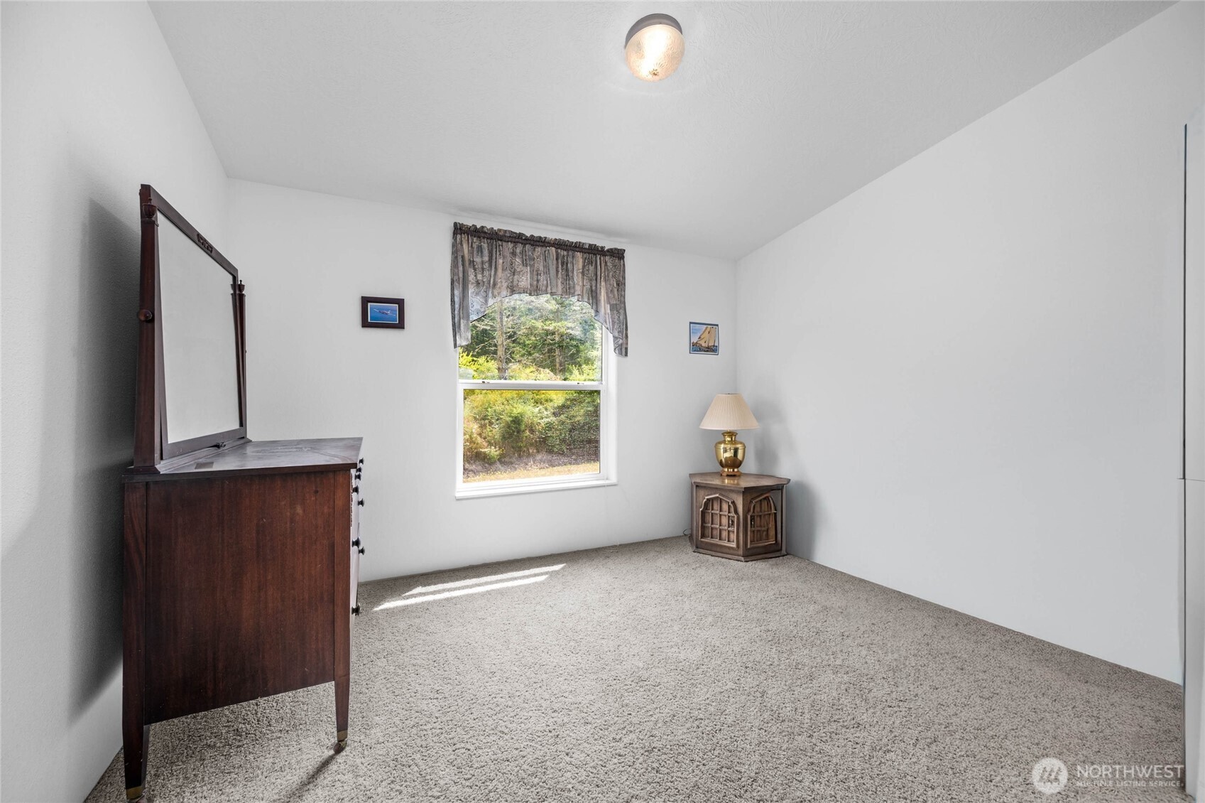 155 Airport Perimeter Way Decatur Island, WA 98221 - Photo 13 of 26 a room with a window and a couch