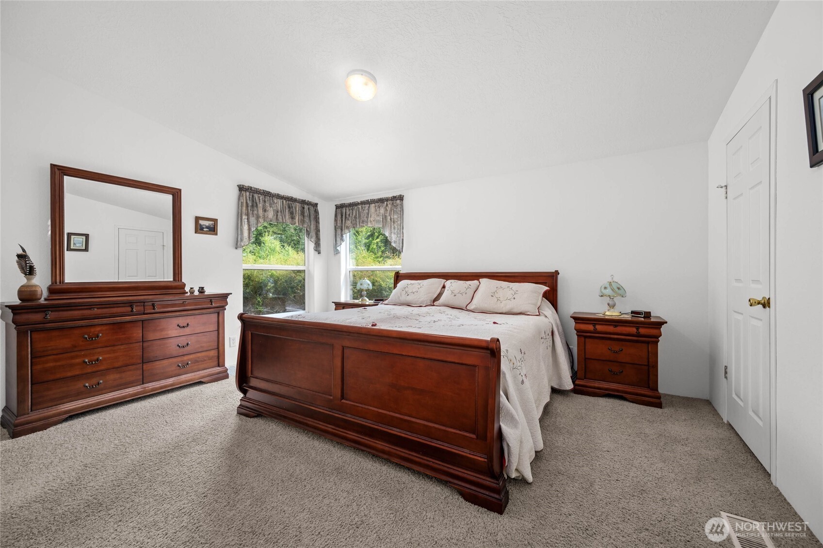155 Airport Perimeter Way Decatur Island, WA 98221 - Photo 17 of 26 a bed room with a bed and a dresser