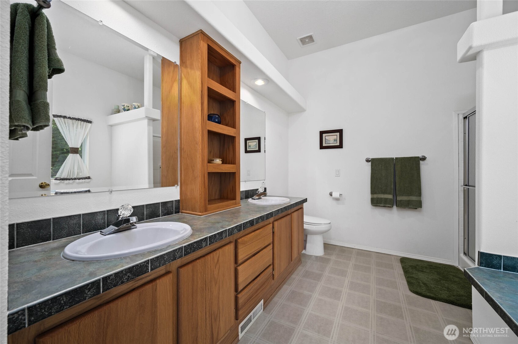 155 Airport Perimeter Way Decatur Island, WA 98221 - Photo 20 of 26 a bathroom with a granite countertop sink and a mirror