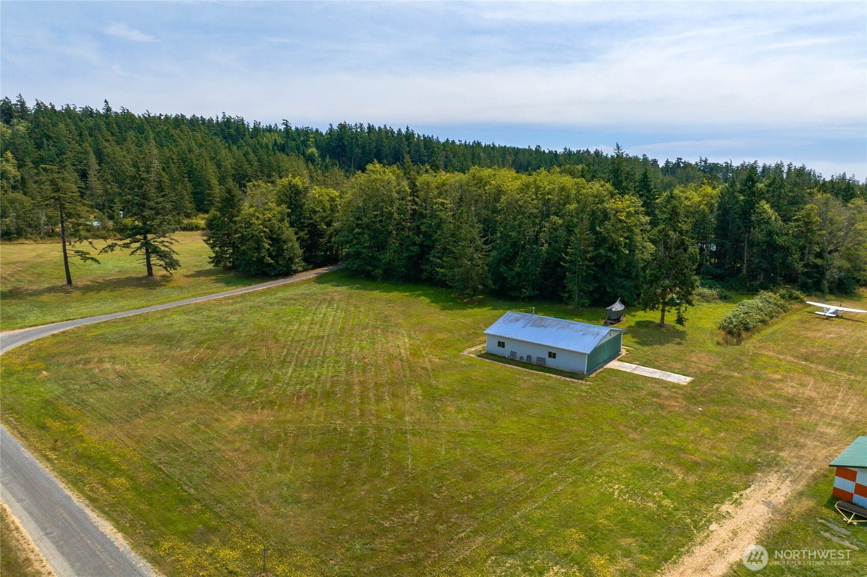 155 Airport Perimeter Way Decatur Island, WA 98221 - Photo 23 of 26 a view of an outdoor space and yard