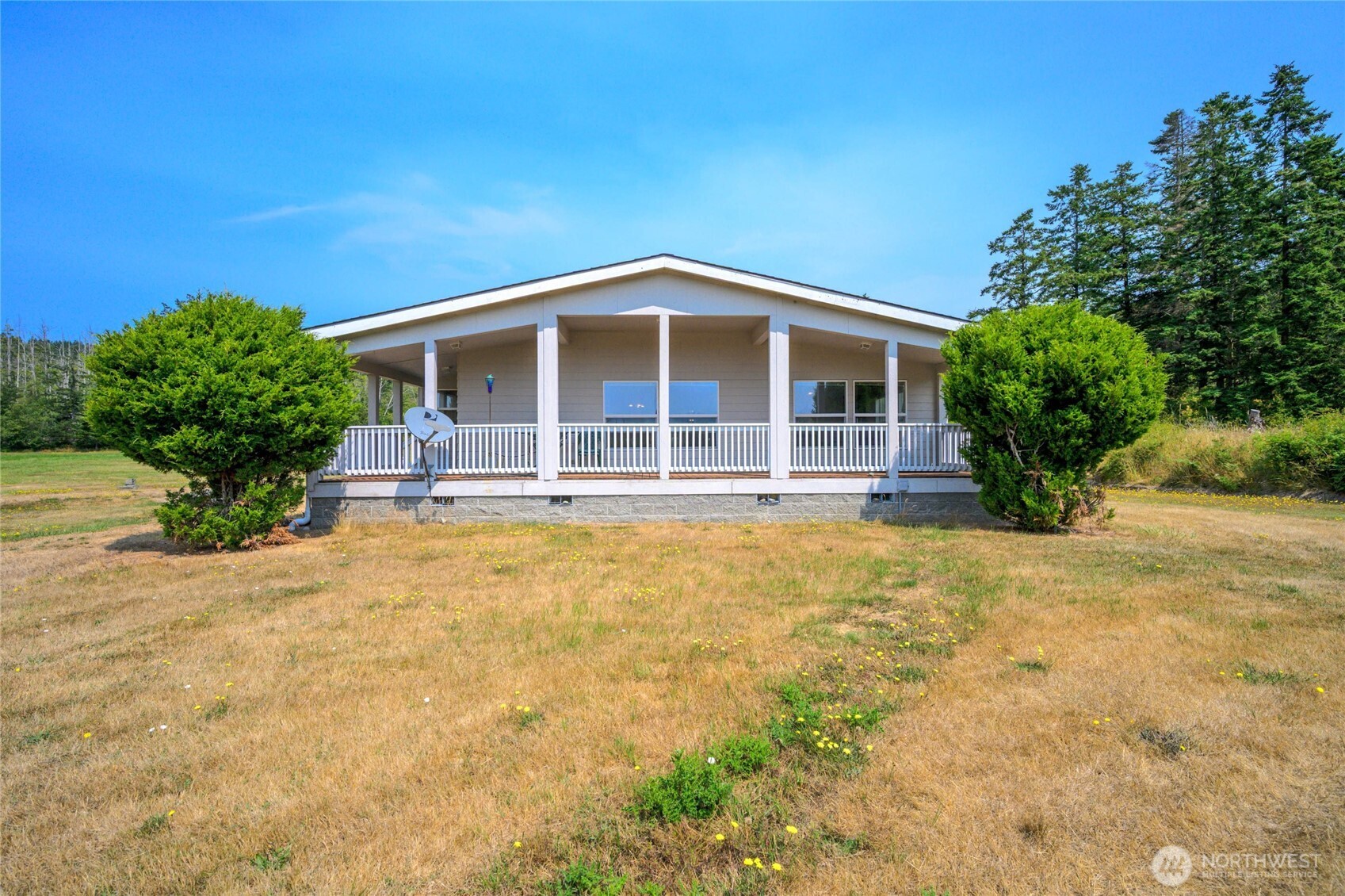 155 Airport Perimeter Way Decatur Island, WA 98221 - Photo 3 of 26 a front view of a house with a yard