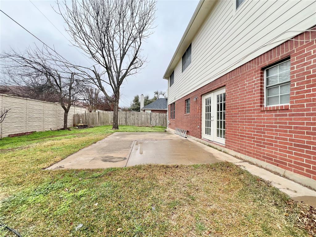 1809 Springwater Drive Round Rock, TX 78681 - Photo 17 of 25 Fenced backyard with a patio area and french doors