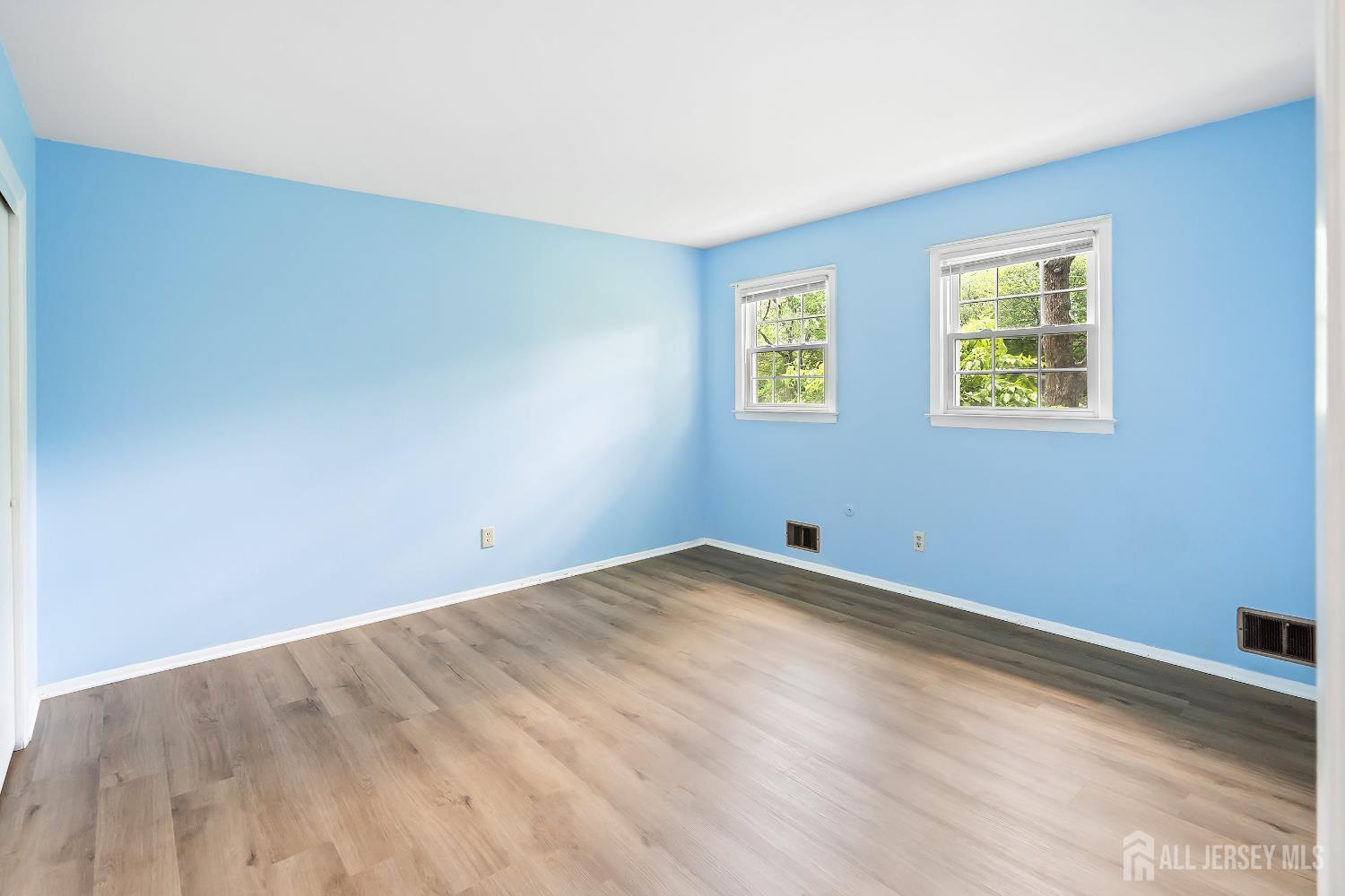 10 Woodruff Road Edison, NJ 08820 - Photo 9 of 18 a view of empty room with wooden floor