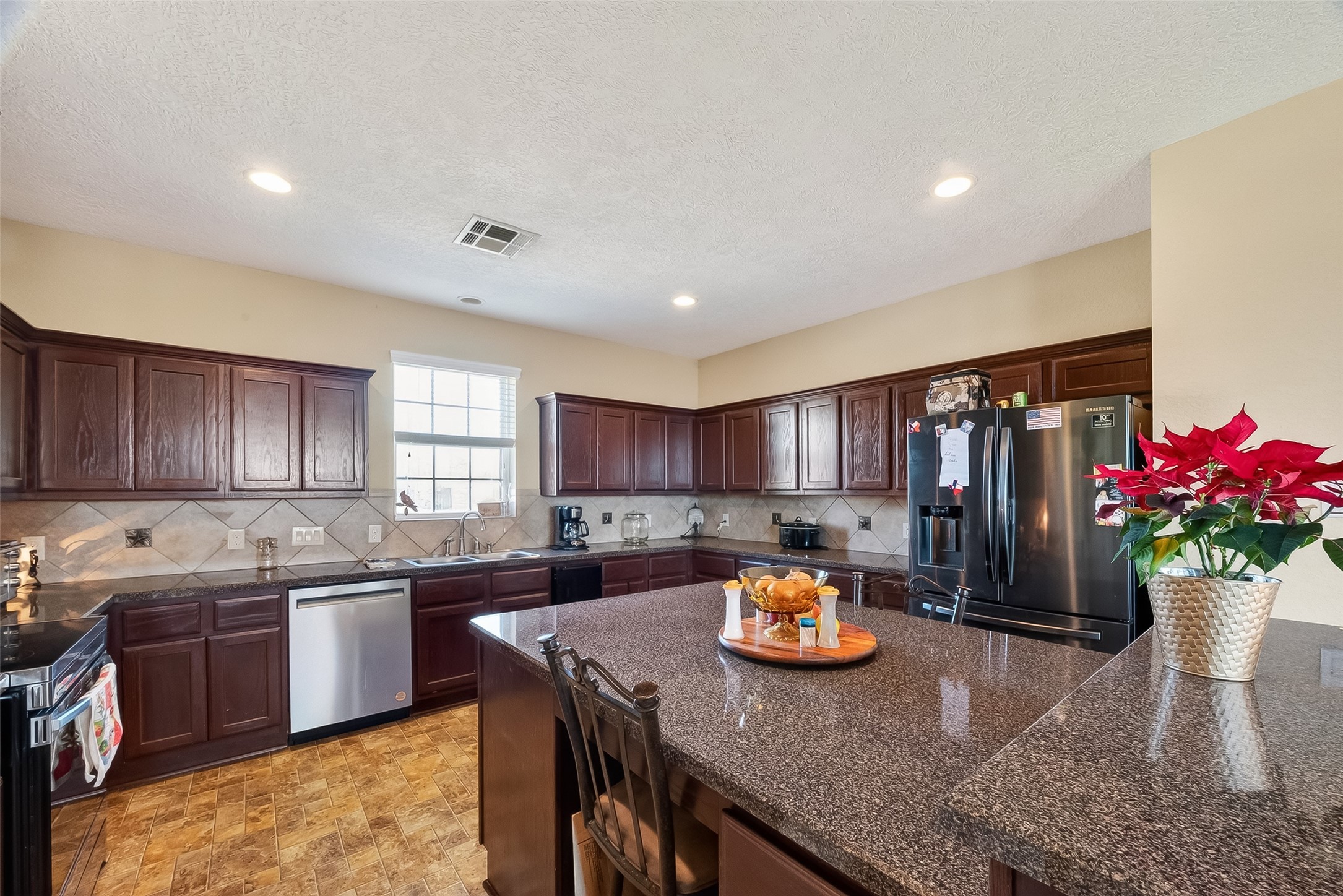 3418 Barbers Hill Road Highlands, TX 77562 - Photo 27 of 50 a kitchen with a sink and cabinets
