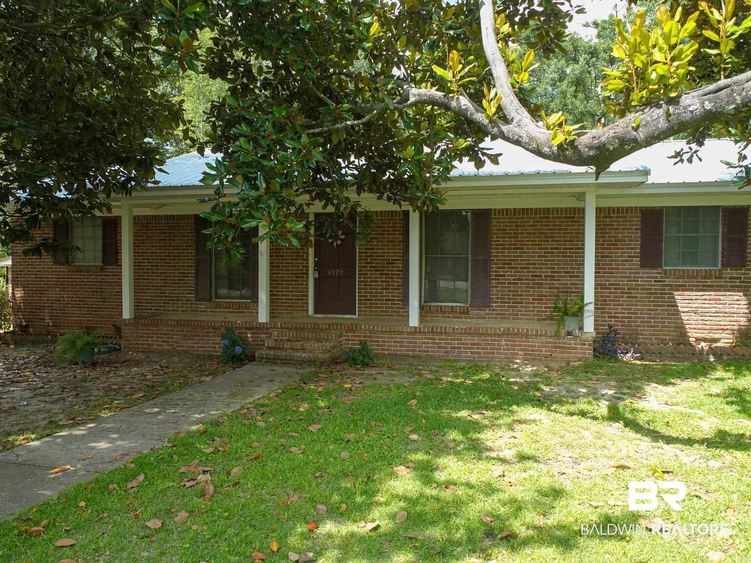 4079 Ronald Avenue Loxley, AL 36551 - Photo 3 of 29 Overlooking Magnolia Trees and Quiet Street