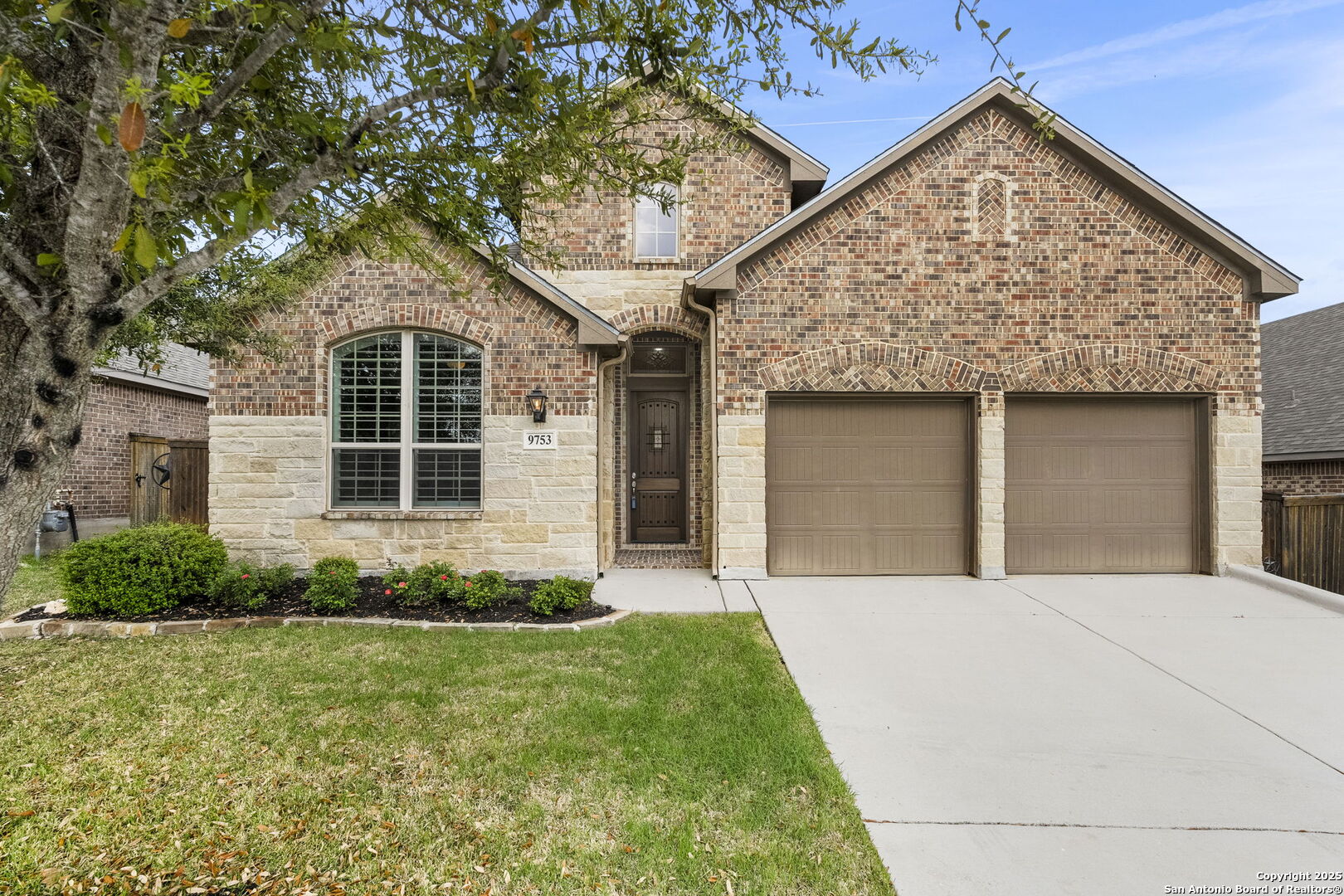 9753 Monken Boerne, TX 78006 - Photo 1 of 38 a front view of a house with garden