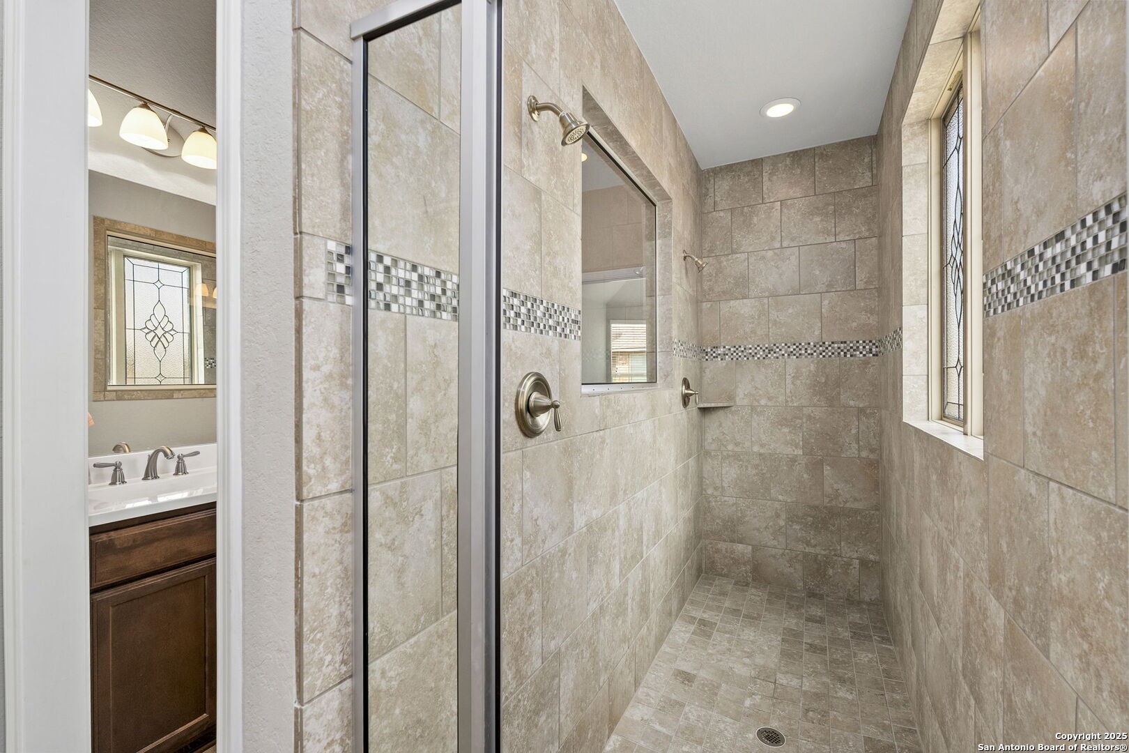 9753 Monken Boerne, TX 78006 - Photo 16 of 38 a bathroom with a shower and a tub