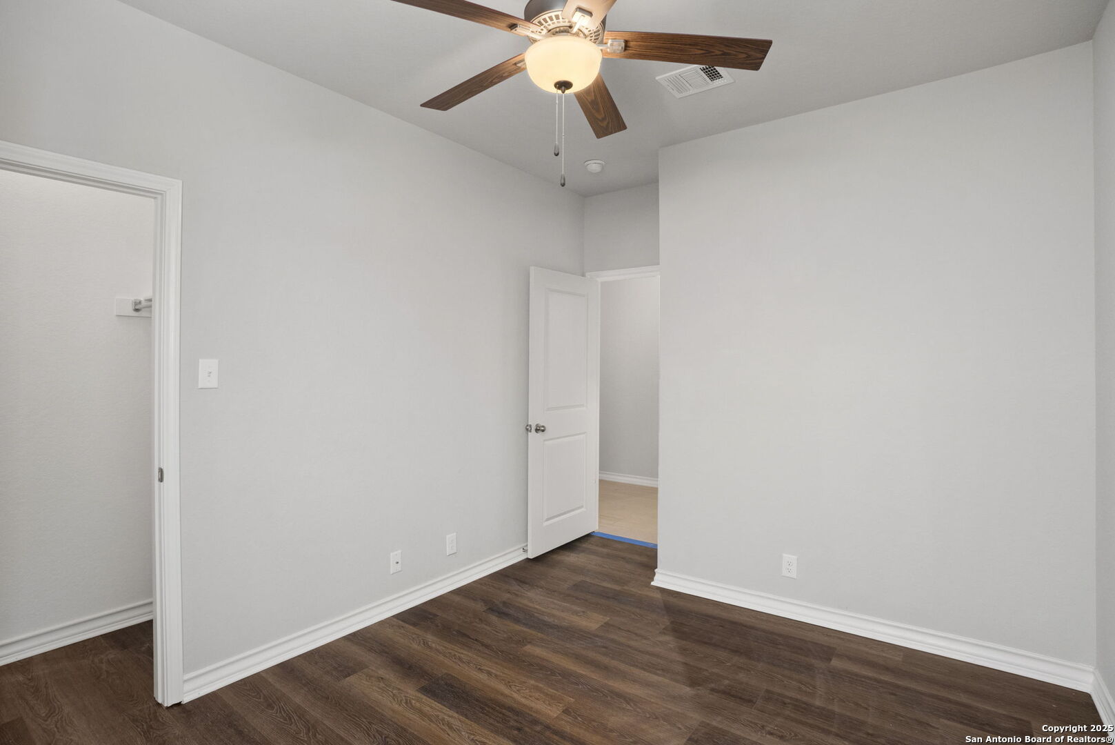 9753 Monken Boerne, TX 78006 - Photo 18 of 38 a view of an empty room with wooden floor
