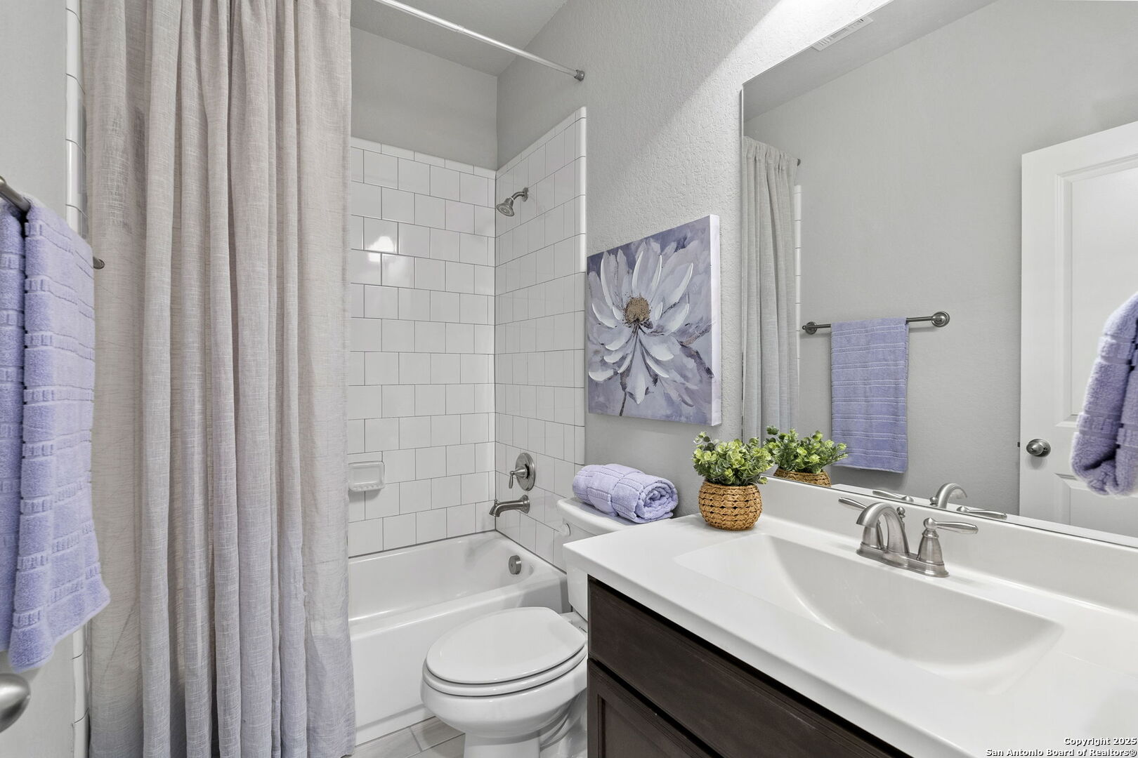 9753 Monken Boerne, TX 78006 - Photo 20 of 38 a bathroom with a sink toilet vanity and shower