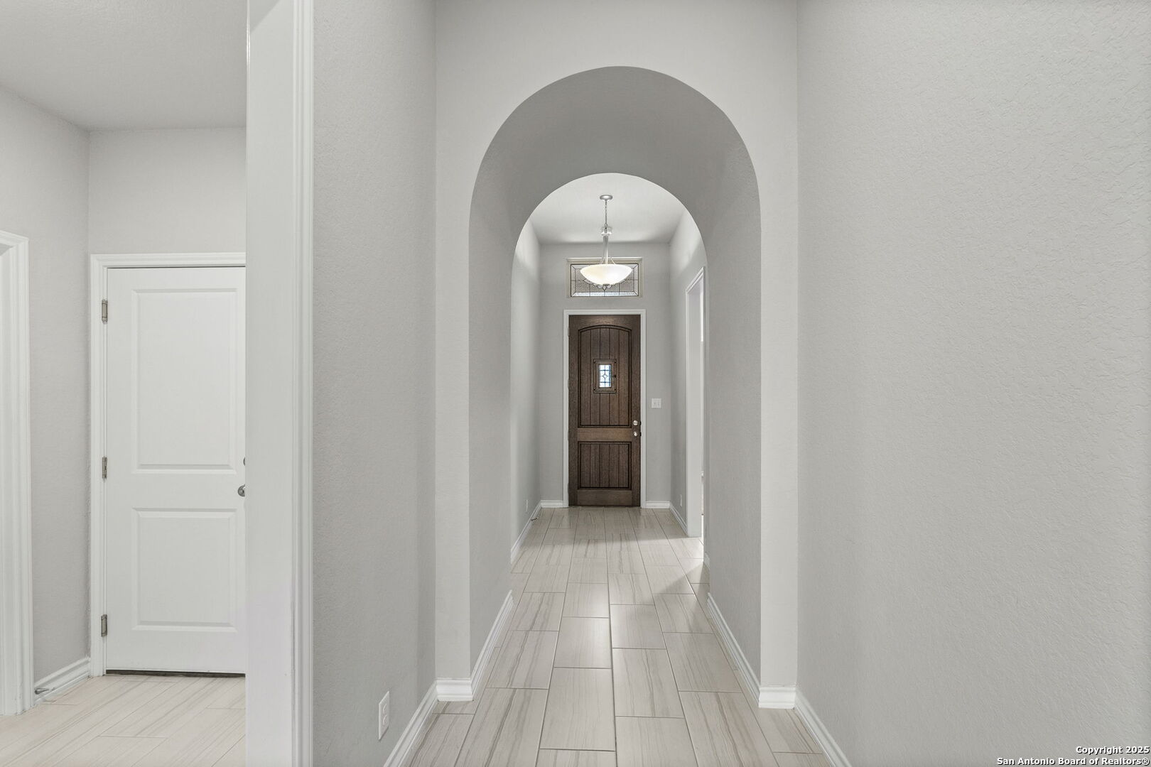 9753 Monken Boerne, TX 78006 - Photo 21 of 38 a view of a hallway with wooden floor