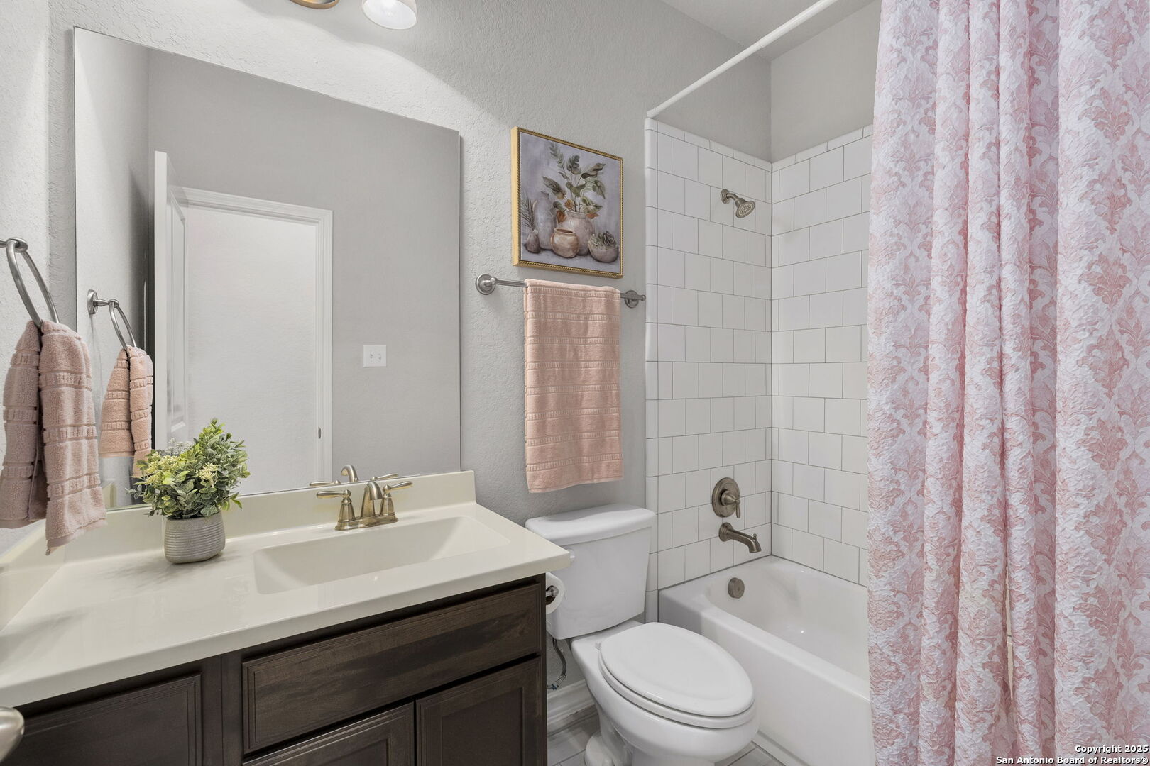 9753 Monken Boerne, TX 78006 - Photo 25 of 38 a bathroom with a sink a toilet a tub and shower