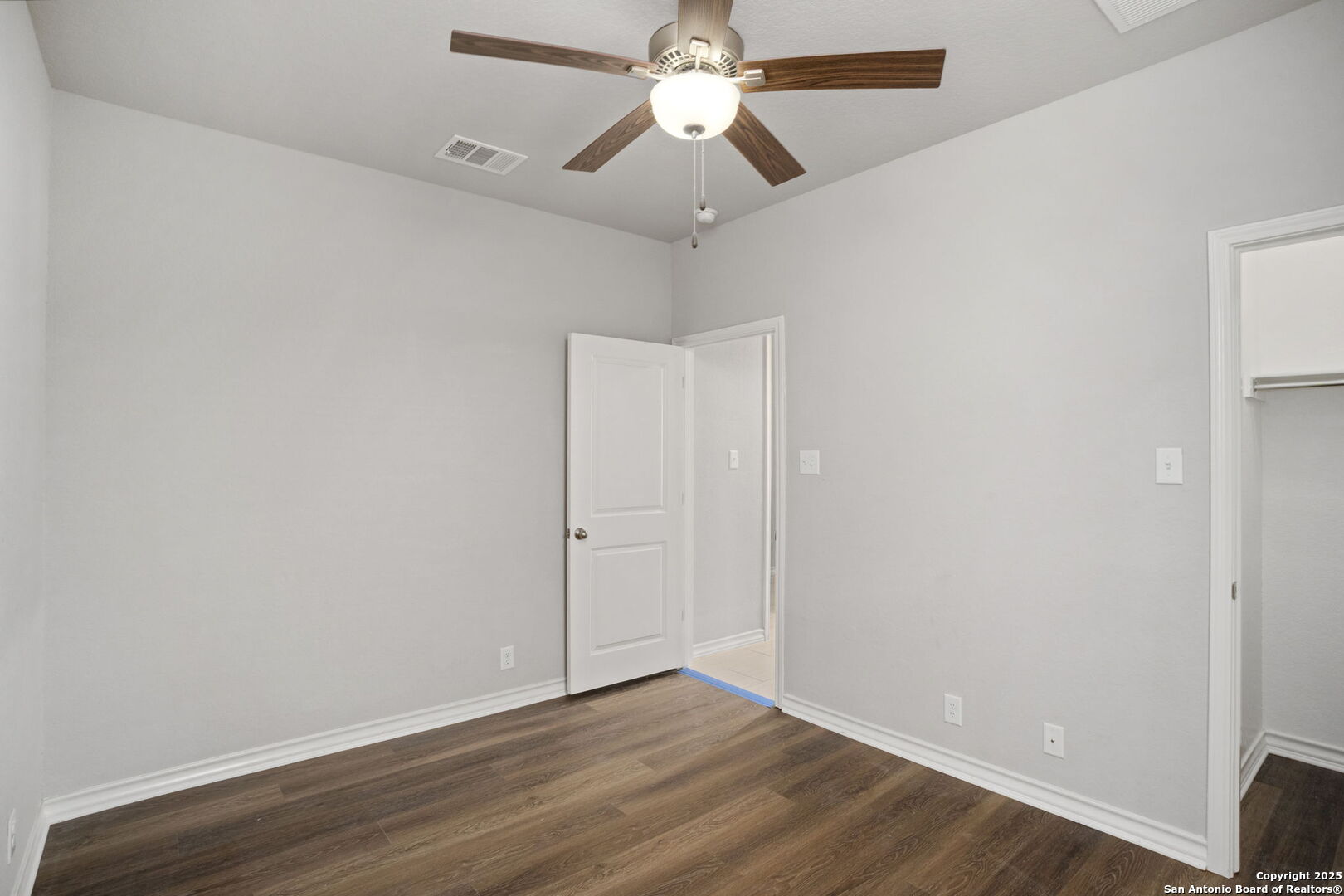 9753 Monken Boerne, TX 78006 - Photo 26 of 38 a view of an empty room with wooden floor