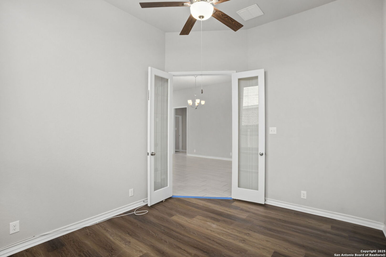 9753 Monken Boerne, TX 78006 - Photo 28 of 38 a view of an empty room with wooden floor