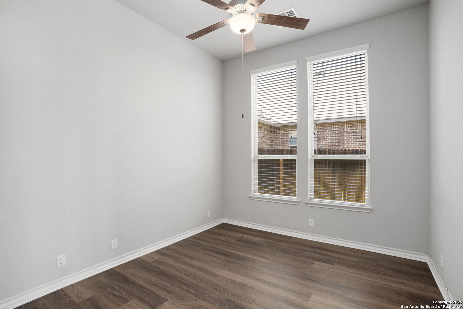 9753 Monken Boerne, TX 78006 - Photo 29 of 38 an empty room with wooden floor and windows