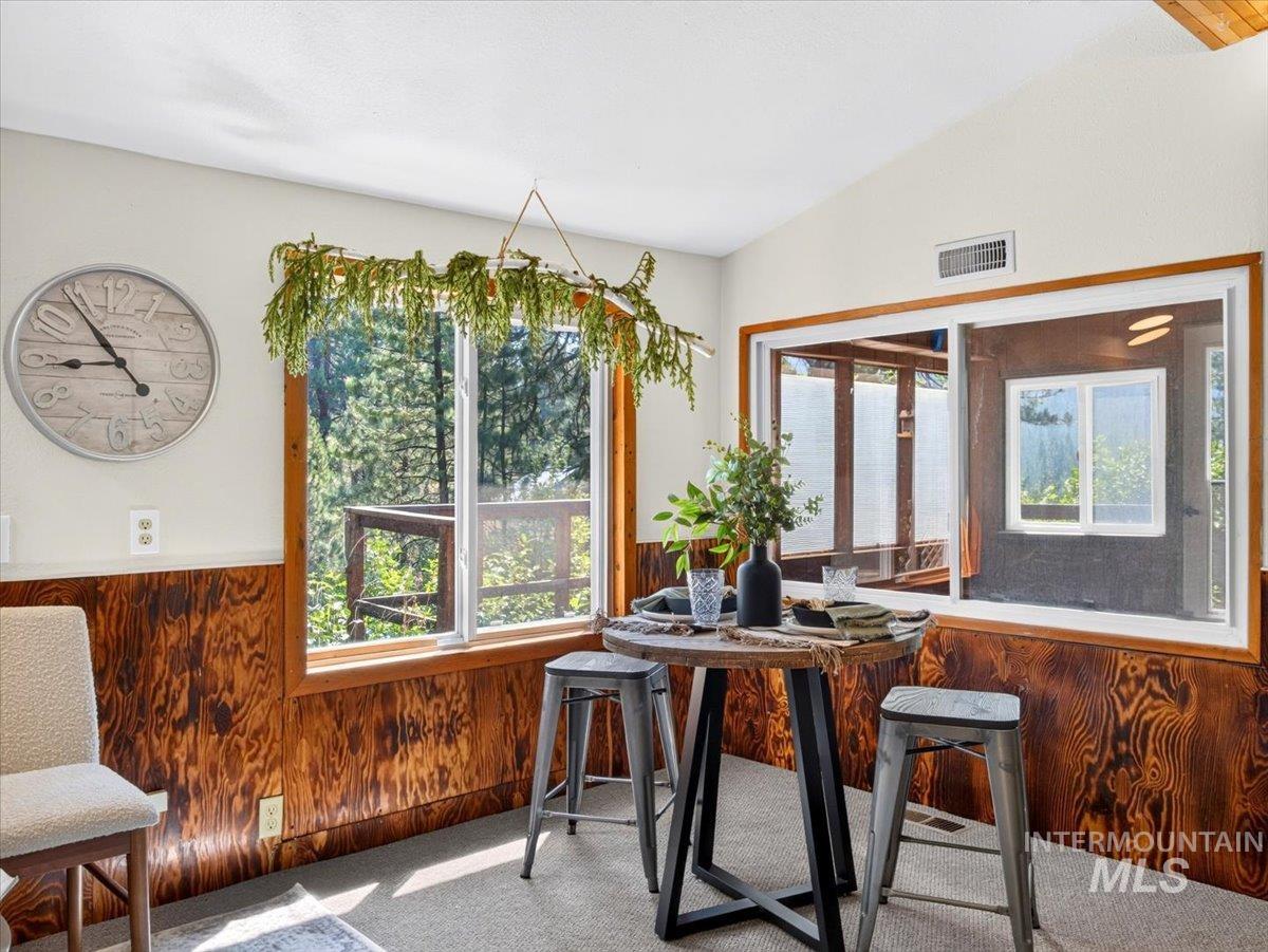 6 Rattlesnake Road Boise City, ID 83716 - Photo 25 of 50 Interior space featuring extensive wood-paneled wainscoting and large windows